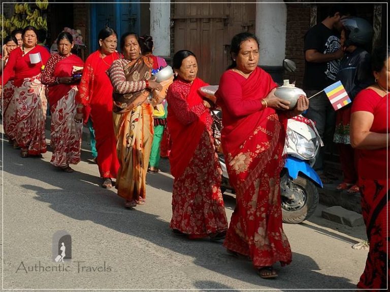 Patan: women dressed in red going to the inauguration of the Itiraz Mahavihar-n Monastery