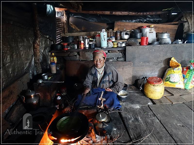Tamang Heritage Trail - Day 3: Brimdang hamlet - local woman cooking nettle sauce for dhal bhat