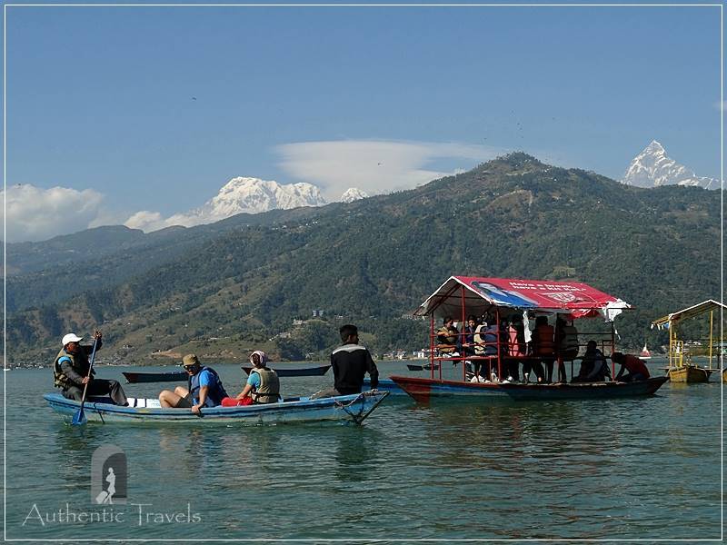 Pokhara: crossing the Phewa Lake with the Himalayas in the background