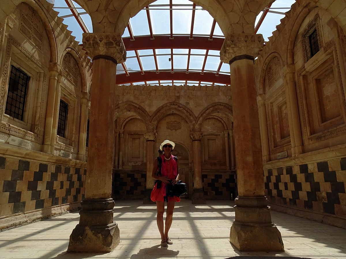 Woman standing inside the historic Ishak Pasha Palace in Doğubayazıt, eastern Turkey.