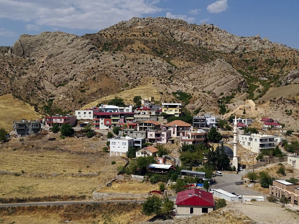 View of Yenikale village surrounded by rocky mountains near Mount Nemrut in eastern Turkey.